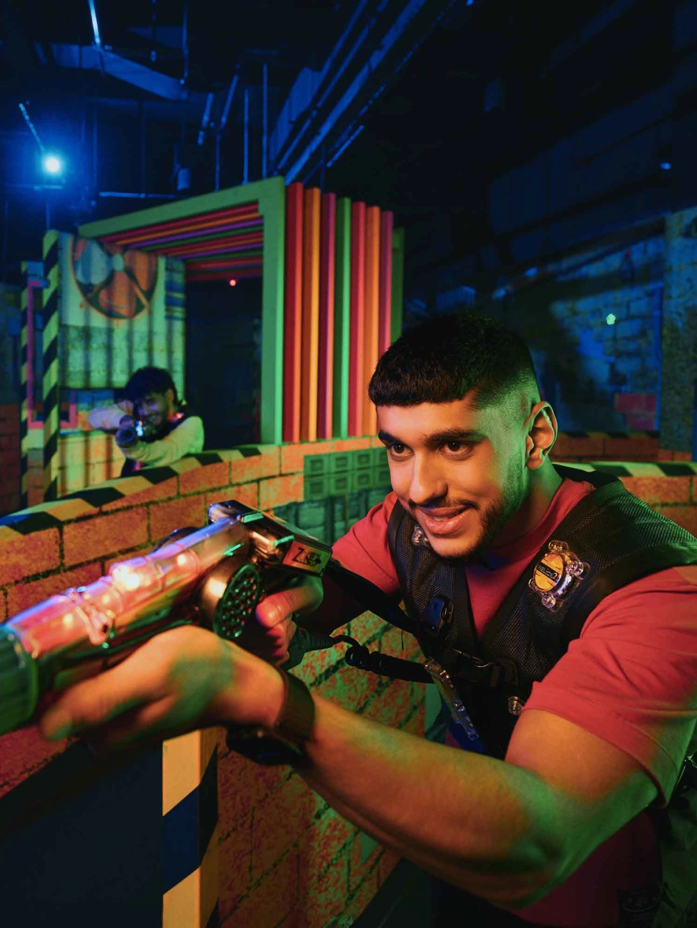 Young boy playing with a toy gun